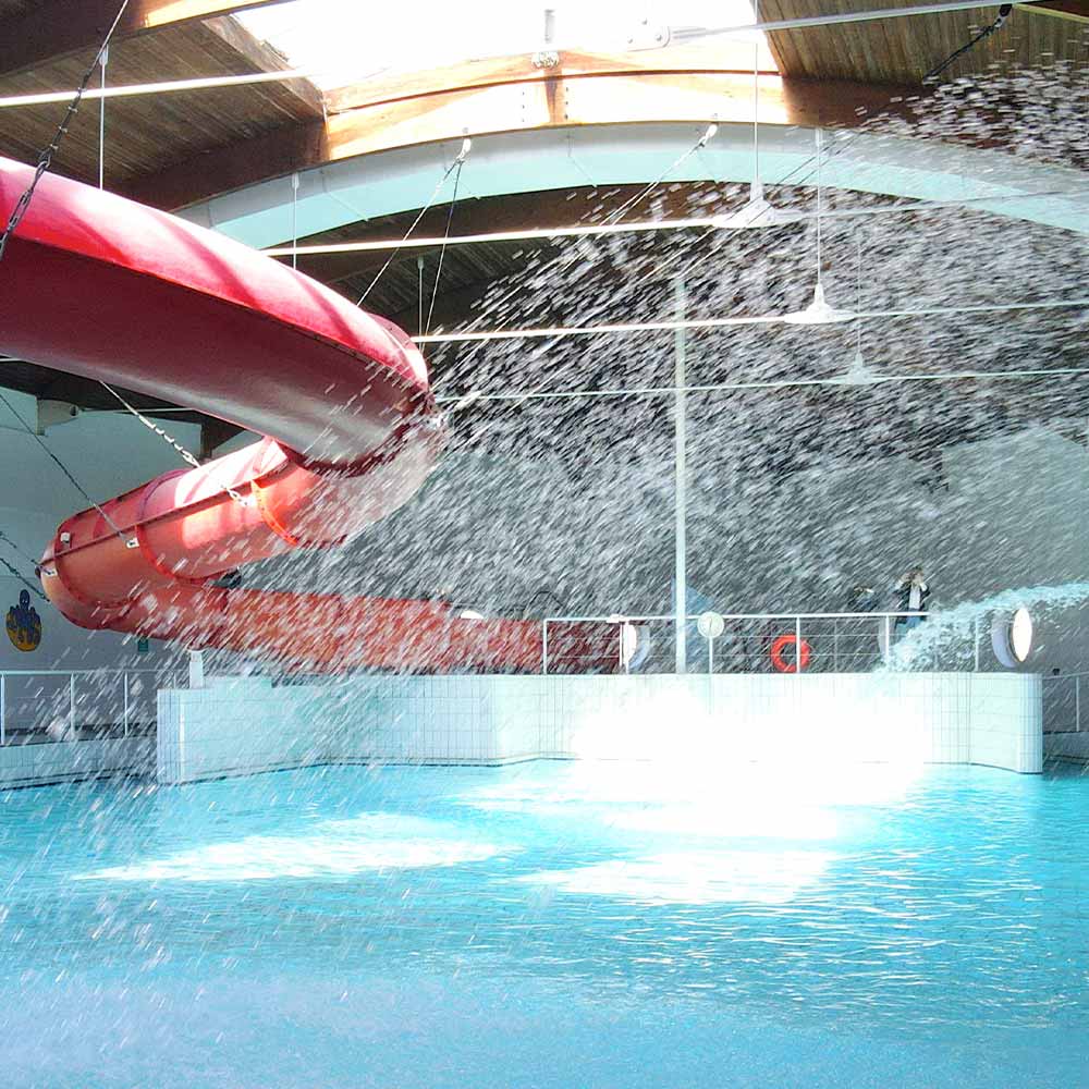 interior of Kilkee Waterworld featuring the red water slide and indoor pool